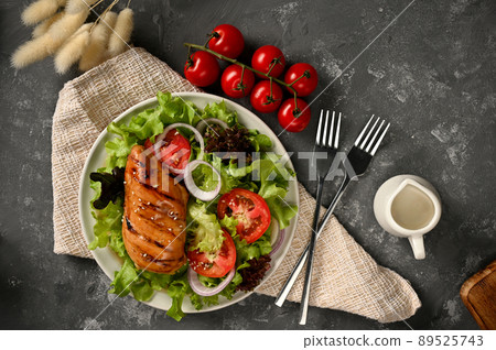 Organic fresh salad with roasted chicken breast served with healthy salad seasoning. 89525743