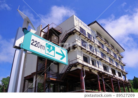 Earthquake Heritage Taro Kanko Hotel Ruins and Tsunami Evacuation Route Instruction Board 89527209