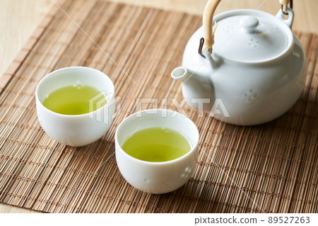 Green tea brewed in a teapot Green tea brewed in a teapot 89527263
