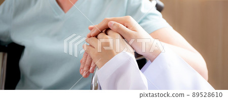 Doctor woman encourage and talking patient senior sitting wheelchair at the hospital. 89528610