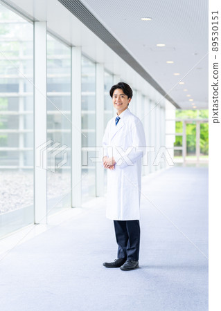 A young man in a white coat A young man in a white coat 89530151