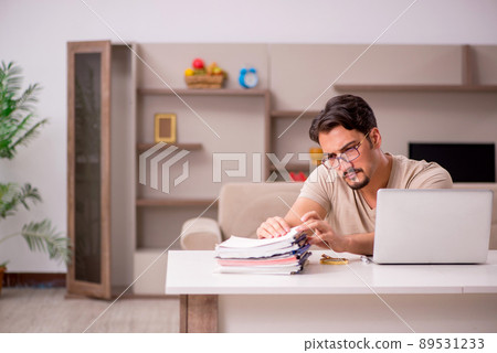 Young male employee working from house 89531233