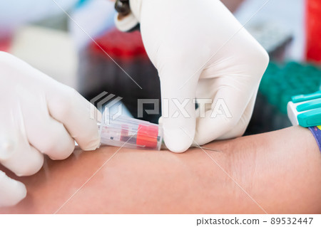 Nurse collecting a blood from patient in hospital 89532447