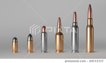 Bullets of different calibers stand in row. 89533337