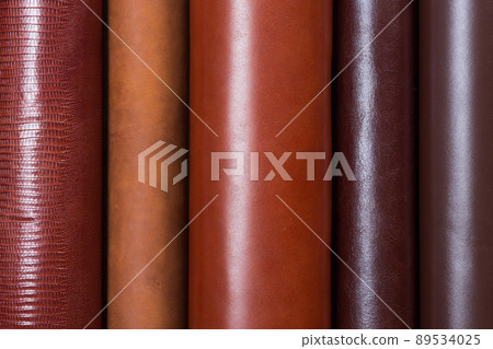 Beige, brown leather rolls. Can be used as background. Beige, brown leather rolls. Can be used as background. 89534025