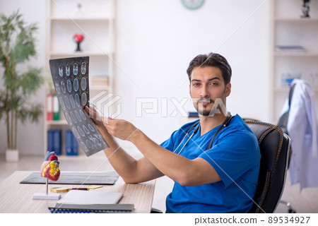 Young male doctor radiologist working in the clinic Young male doctor radiologist working in the clinic 89534927