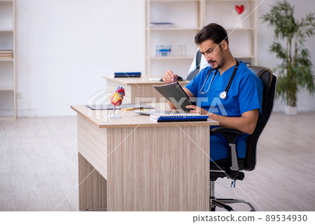 Young male doctor working in the clinic Young male doctor working in the clinic 89534930