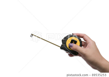 Female hand holding a tape measure isolated on white background. 89535253