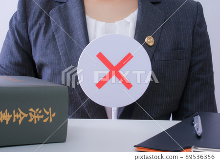Female lawyer with a cross plate 89536356