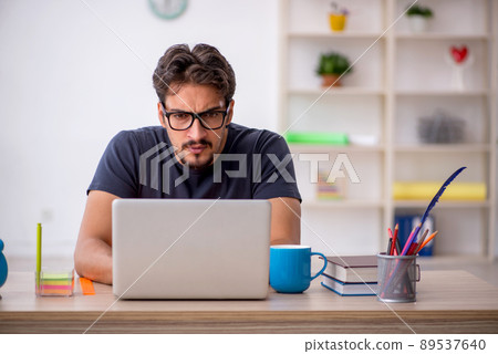Young male designer working in the office Young male designer working in the office 89537640
