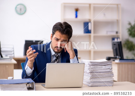 Young male employee working in the office 89538233