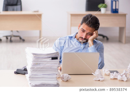 Young male employee rejecting new ideas in the office Young male employee rejecting new ideas in the office 89538374