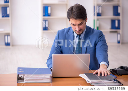 Young businessman employee working in the office Young businessman employee working in the office 89538669