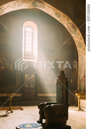 Mtskheta, Georgia. Sun ray shining in church. Fresco, Frescoes. Icons, of Shio-Mgvime Monastery. interior of Upper Church Of Holy Virgin Or Theotokos, Central Part Of Medieval Monastic ShioMgvime Mtskheta, Georgia. Sun ray shining in church. Fresco, Frescoes. Icons, of Shio-Mgvime Monastery. interior of Upper Church Of Holy Virgin Or Theotokos, Central Part Of Medieval Monastic ShioMgvime 89538866