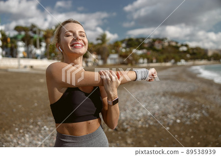 Caucasian female at daily fitness regime outdoors Caucasian female at daily fitness regime outdoors 89538939