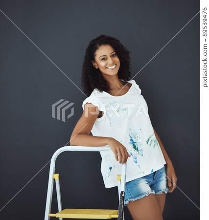 Happiness is being able to express creativity. Portrait of an attractive young female painter in the studio. 89539476