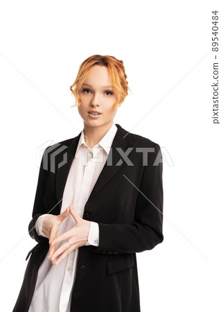 Young businesswoman standing in white studio and looking at camera 89540484