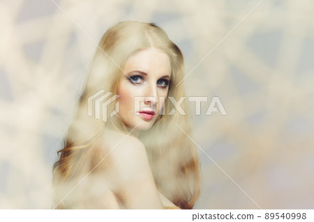 Portrait of young beautiful woman with long flowing hair. Fashion photo Portrait of young beautiful woman with long flowing hair. Fashion photo 89540998