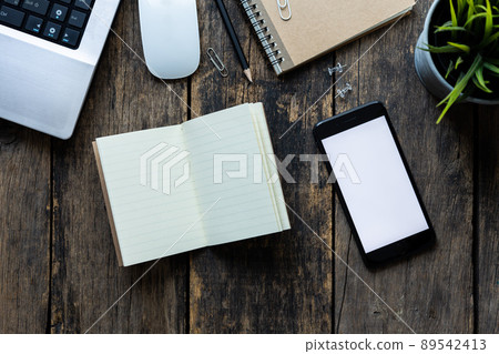 Top view office desk with blank notebook. with Computer  and other office equipment with copyspace 89542413
