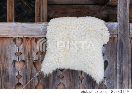 Sheep skin on in a wood house in rural countryside. Travel, tourism and environment concept. 89543159