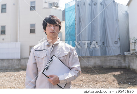 A businessman investigating a house 89545680