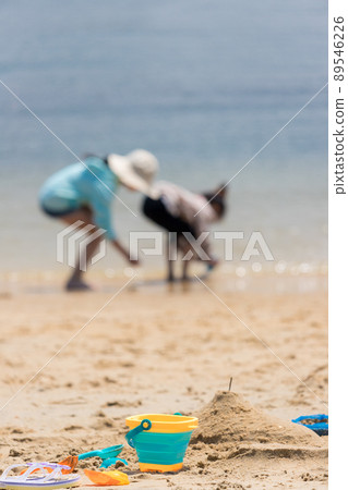 Kids playing on the beach in the summer sea Kids playing on the beach in the summer sea 89546226