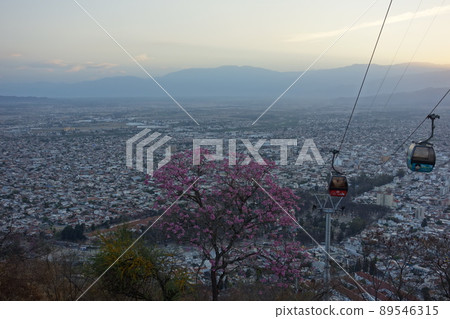 panoramic of Salta, Argentina, and cablecar cabin above. sunset, cityscape buildings 89546315