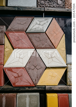 Paving slabs of different colors and shapes.Decorative cobblestones are different in color and shape. 89547094