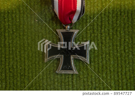 Nazi iron cross old II world war medal on green Nazi iron cross old II world war medal on green 89547727