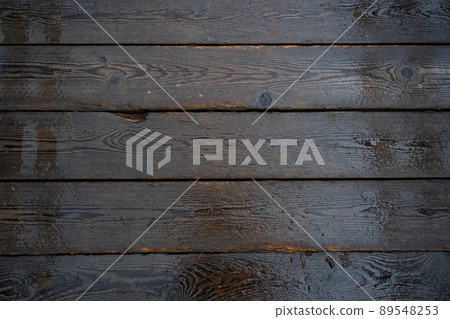 Wet wooden planks after rain as backdrop. Textured parts of rustic house. Wet wooden planks after rain as backdrop. Textured parts of rustic house. 89548253