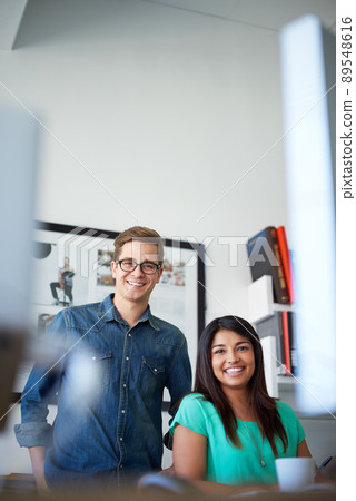 They make a great team. Cropped portrait of two designers in their office. They make a great team. Cropped portrait of two designers in their office. 89548616