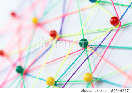 Linking entities, Blockchain, social media, Communications Network, The connection between the two networks. Network simulation on paper linked together by yarn Linking entities, Blockchain, social media, Communications Network, The connection between the two networks. Network simulation on paper linked together by yarn 89549217