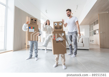 Family playing robots at home Family playing robots at home 89551581