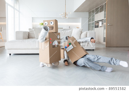Children playing robots at home Children playing robots at home 89551582