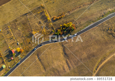 Aerial drone view of winding asphalt road Aerial drone view of winding asphalt road 89551728