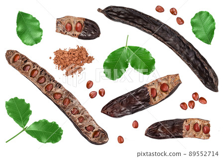 Carob pod and powder isolated on white background with clipping path. Top view. Flat lay Carob pod and powder isolated on white background with clipping path. Top view. Flat lay 89552714