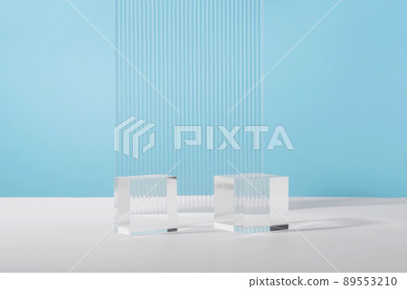 Acrylic plate, podium solid blocks, background for cosmetic product packaging on blue with stylish props. Showcase for jewellery presentation, display for advertising, cosmetics branding scene 89553210