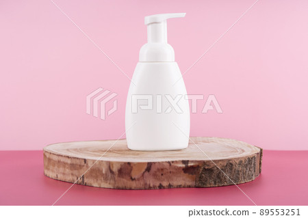 White cream cosmetic product on wooden round podium pedestal. Facial lotion mockup, mousse in dispenser for woman skincare routine. Beauty moisturiser packaging. Eco cosmetics presentation White cream cosmetic product on wooden round podium pedestal. Facial lotion mockup, mousse in dispenser for woman skincare routine. Beauty moisturiser packaging. Eco cosmetics presentation 89553251
