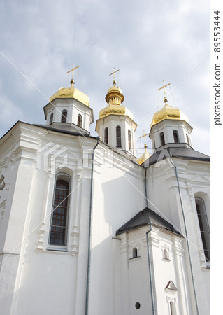 Catherine's Church is a functioning church in Chernihiv, Ukraine. St. Catherine's Church was built in the Cossack period. Golden domes against the sky. Ancient Ukrainian church. Cossack architecture. 89553444