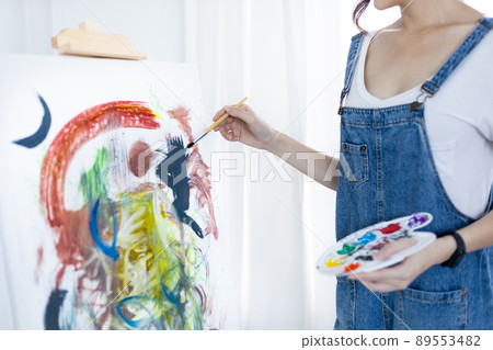 Female artist painting on canvas, Artist studio interior, Draw with watercolor, Drawing supplies , Painting and creativity, Use a brush to draw a pattern by stripes, Artwork, Using Paint Brush. 89553482
