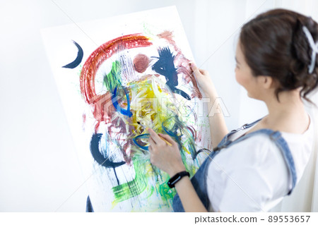 Female artist painting on canvas, Artist studio interior, Draw with watercolor, Drawing supplies , Painting and creativity, Use a brush to draw a pattern by stripes, Artwork, Using Paint Brush. Female artist painting on canvas, Artist studio interior, Draw with watercolor, Drawing supplies , Painting and creativity, Use a brush to draw a pattern by stripes, Artwork, Using Paint Brush. 89553657