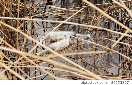 garbage in the water, used glass bottle in the pound garbage in the water, used glass bottle in the pound 89553807