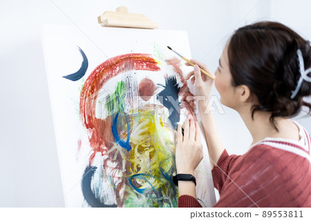 Female artist painting on canvas, Artist studio interior, Draw with watercolor, Drawing supplies , Painting and creativity, Use a brush to draw a pattern by stripes, Artwork, Using Paint Brush. Female artist painting on canvas, Artist studio interior, Draw with watercolor, Drawing supplies , Painting and creativity, Use a brush to draw a pattern by stripes, Artwork, Using Paint Brush. 89553811