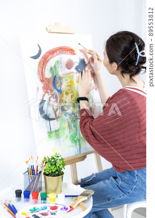 Female artist painting on canvas, Artist studio interior, Draw with watercolor, Drawing supplies , Painting and creativity, Use a brush to draw a pattern by stripes, Artwork, Using Paint Brush. 89553812