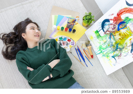 Female artist painting on canvas, Artist studio interior, Draw with watercolor, Drawing supplies , Painting and creativity, Use a brush to draw a pattern by stripes, Artwork, Using Paint Brush. 89553989