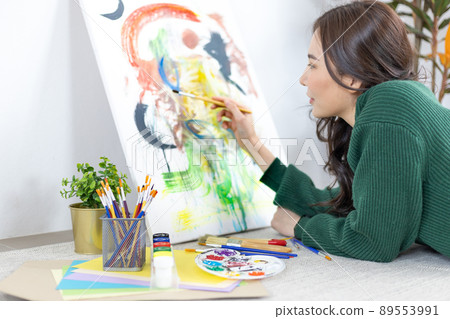 Female artist painting on canvas, Artist studio interior, Draw with watercolor, Drawing supplies , Painting and creativity, Use a brush to draw a pattern by stripes, Artwork, Using Paint Brush. Female artist painting on canvas, Artist studio interior, Draw with watercolor, Drawing supplies , Painting and creativity, Use a brush to draw a pattern by stripes, Artwork, Using Paint Brush. 89553991