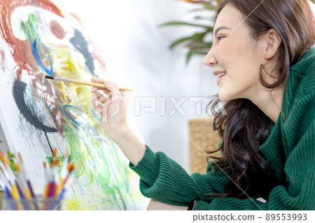 Female artist painting on canvas, Artist studio interior, Draw with watercolor, Drawing supplies , Painting and creativity, Use a brush to draw a pattern by stripes, Artwork, Using Paint Brush. Female artist painting on canvas, Artist studio interior, Draw with watercolor, Drawing supplies , Painting and creativity, Use a brush to draw a pattern by stripes, Artwork, Using Paint Brush. 89553993