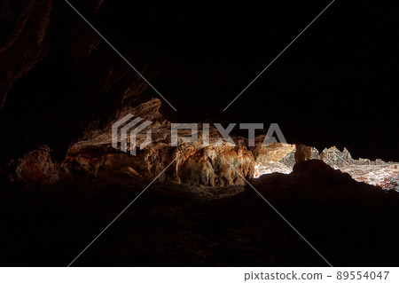 Old stone bat cave in the rock. Tourist attraction. Walk in the cave 89554047