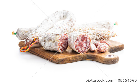 Traditional sausage with white mold. Dried pork salami isolated on white background. Traditional sausage with white mold. Dried pork salami isolated on white background. 89554569
