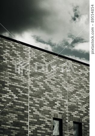 Modern bricks building with dramatic sky Modern bricks building with dramatic sky 89554854
